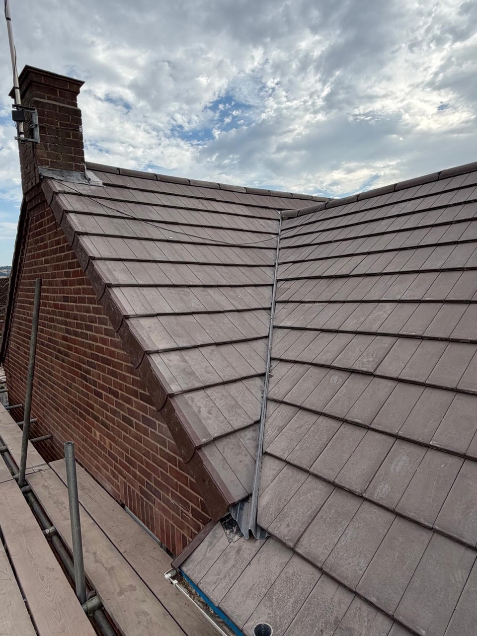 After roof replacement showing finished tiled roof and valley detail
